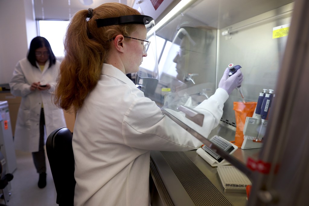 Microbiologist Anne Vandenburg-Carroll tests poultry samples collected from a farm located in a control area for the presence of avian influenza at the Wisconsin Veterinary Diagnostic Laboratory at the University of Wisconsin-Madison on March 24, 2022. Centers for Disease Control and Prevention have identified 46 human cases of bird flu since April.